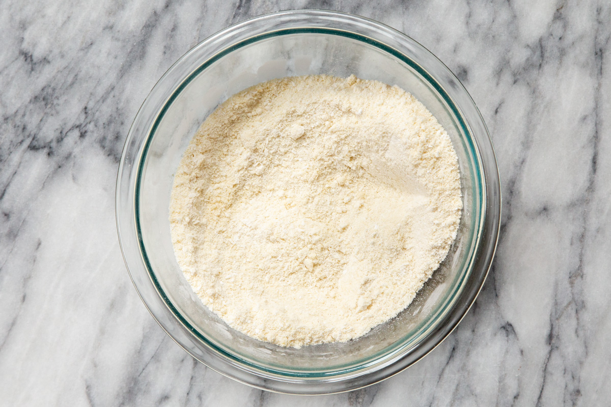 dry ingredients for vegan almond joy cookies in a glass bowl