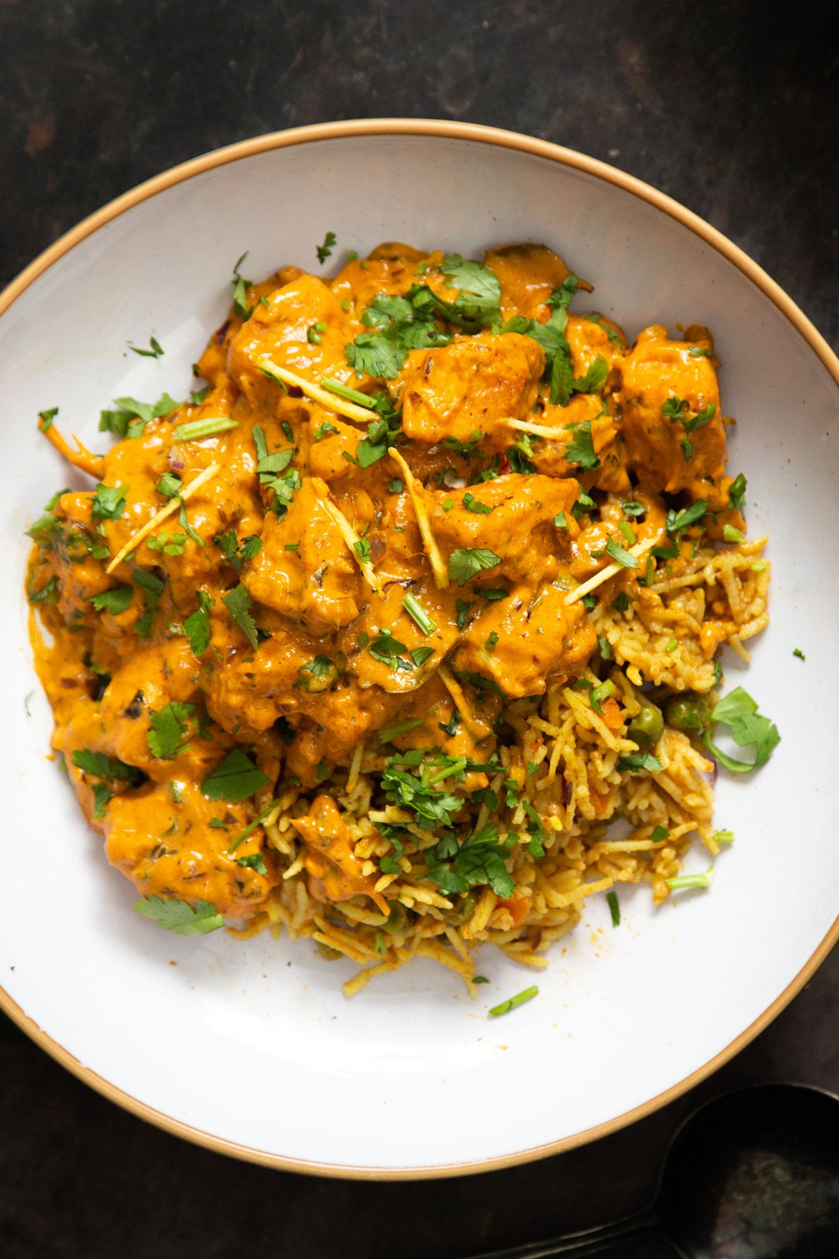 a plate of Indian vegan Lasooni Chicken sprinkled with cilantro 