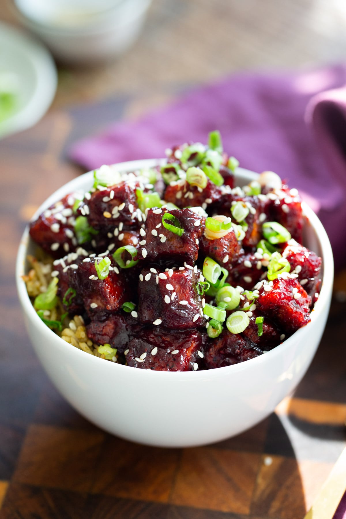 blackberry glazed tofu served over rice sprinkled with sesame seeds