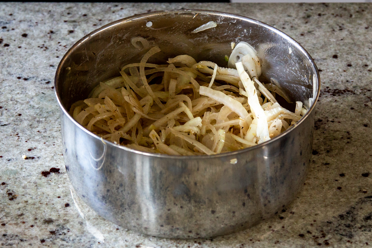 sliced onions tossed with butter and spices in an Instant Pot