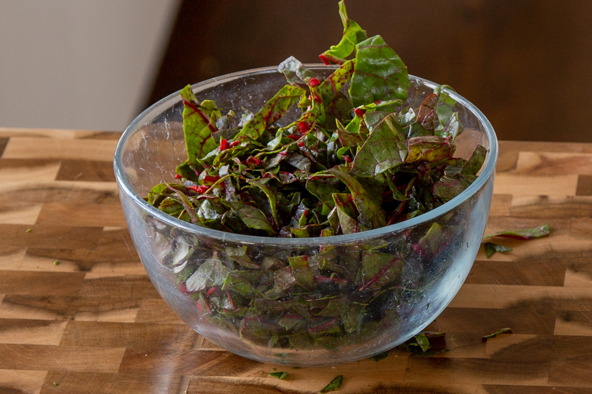 bite-sized pieces of Swiss chard in a glass bowl
