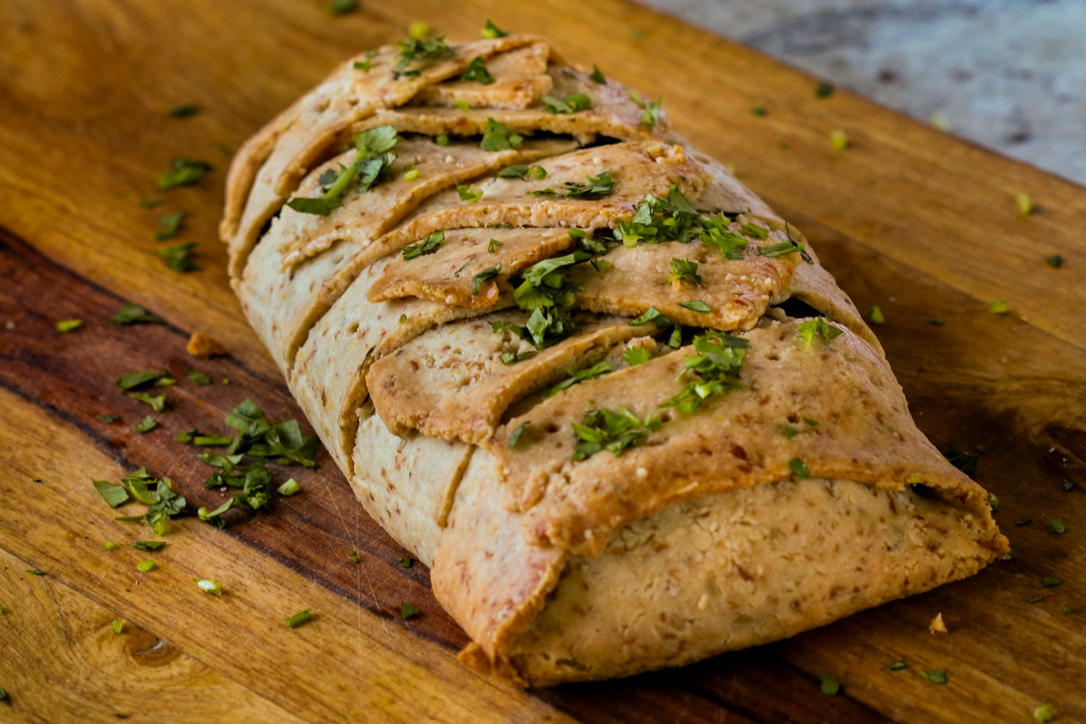gluten-free vegan beef Wellington on the cutting board after baking