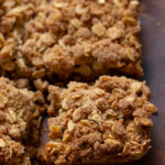 slice of pumpkin crisp on a wooden board