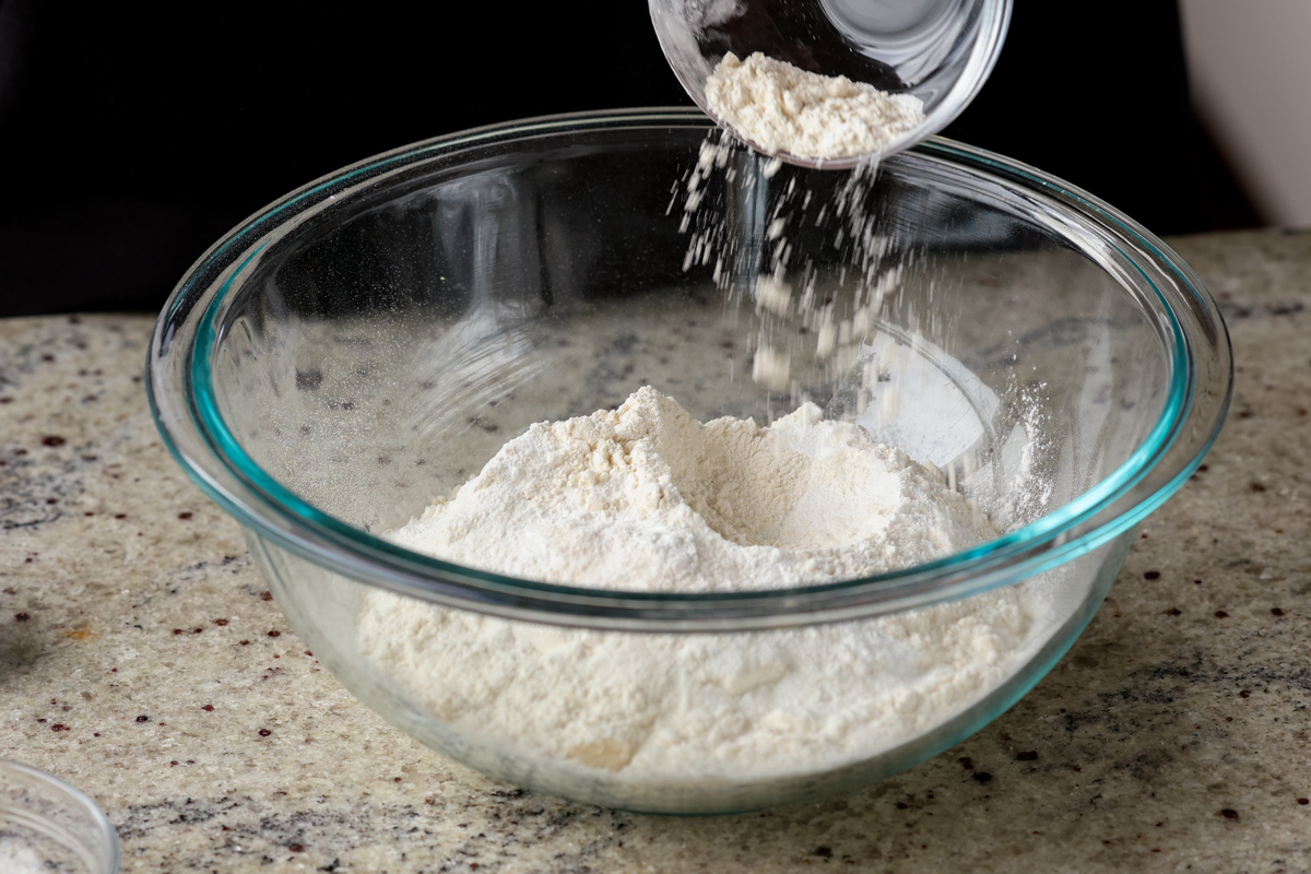 adding dry ingredients to the bowl