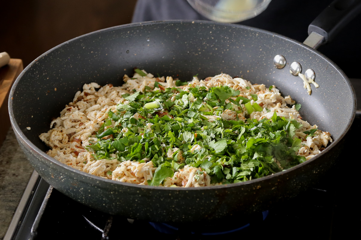adding cilantro to the tofu