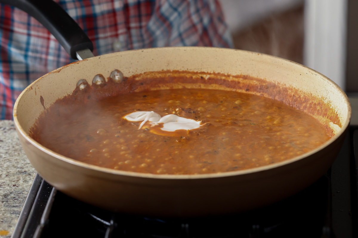 adding more non-dairy yogurt to the sauce
