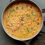 lemon white bean soup in the pan with garnishes