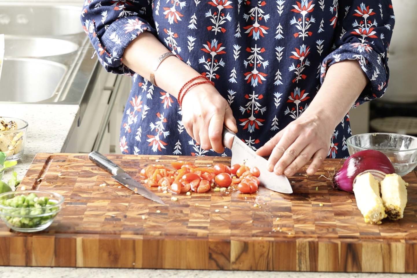 chopping the tomatoes
