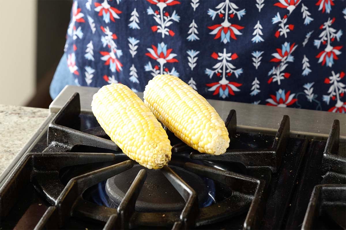 cooking corn on a gas stove