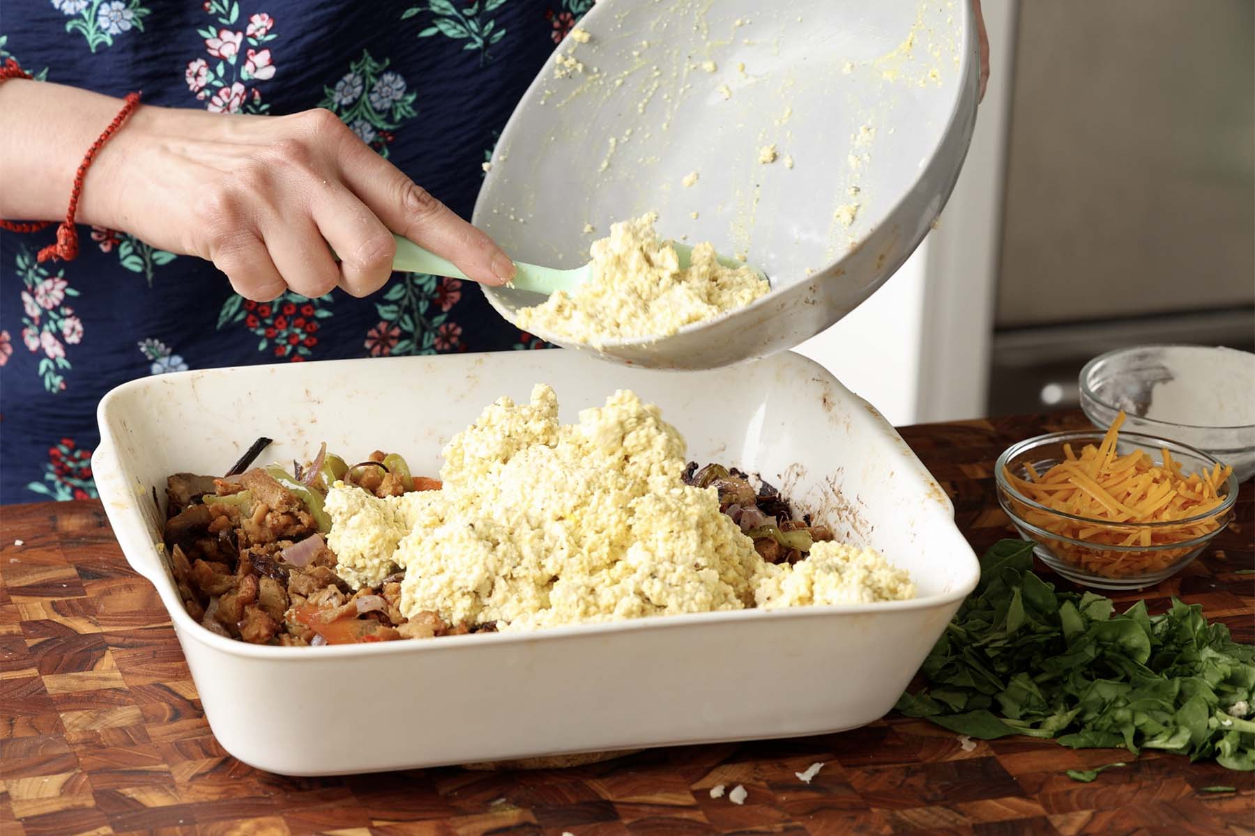 adding the tofu mixture to the pan