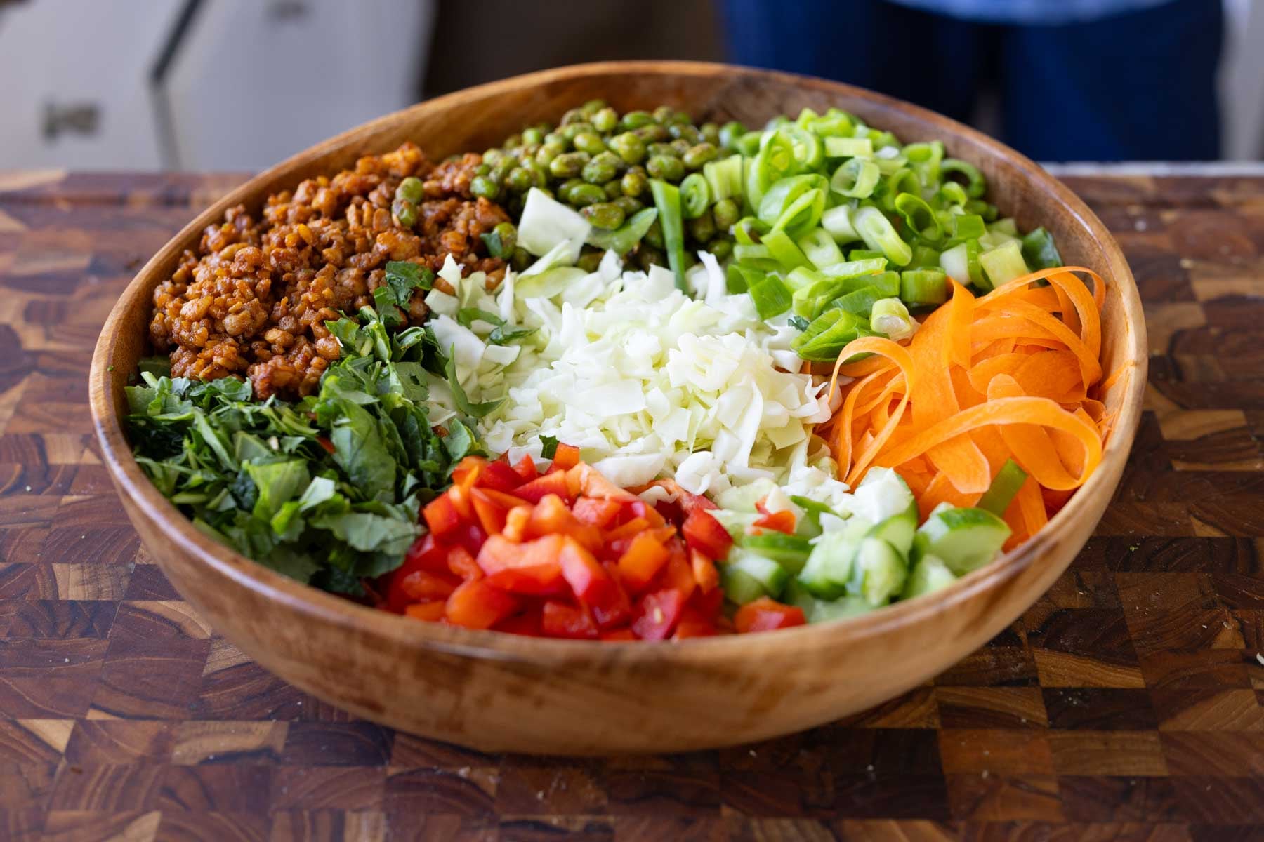gochujang salad ingredients in a bowl before mixing
